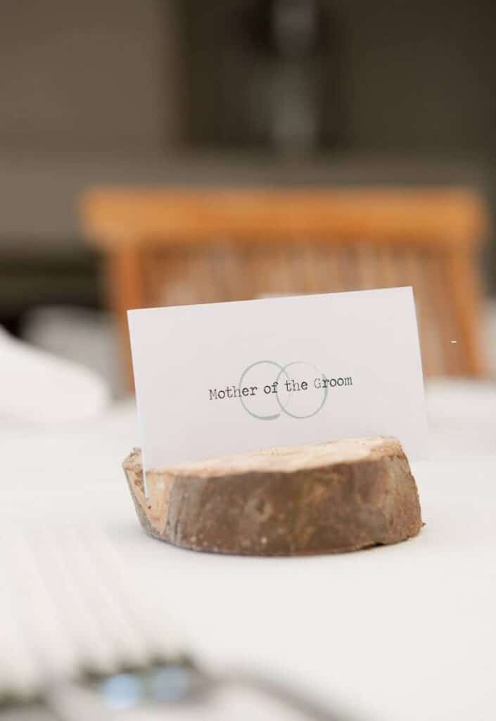 a wooden place card for wedding dinner seating