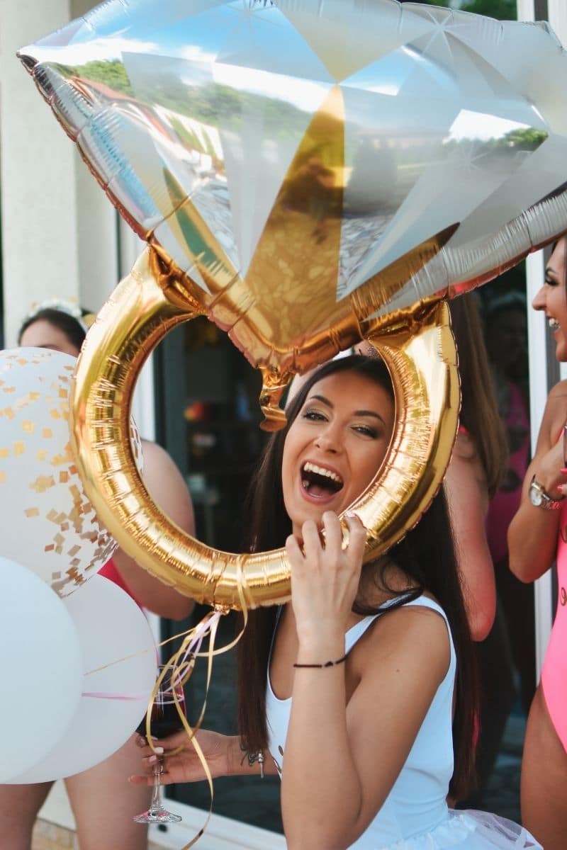 a bride to be with a ring shaped balloon.